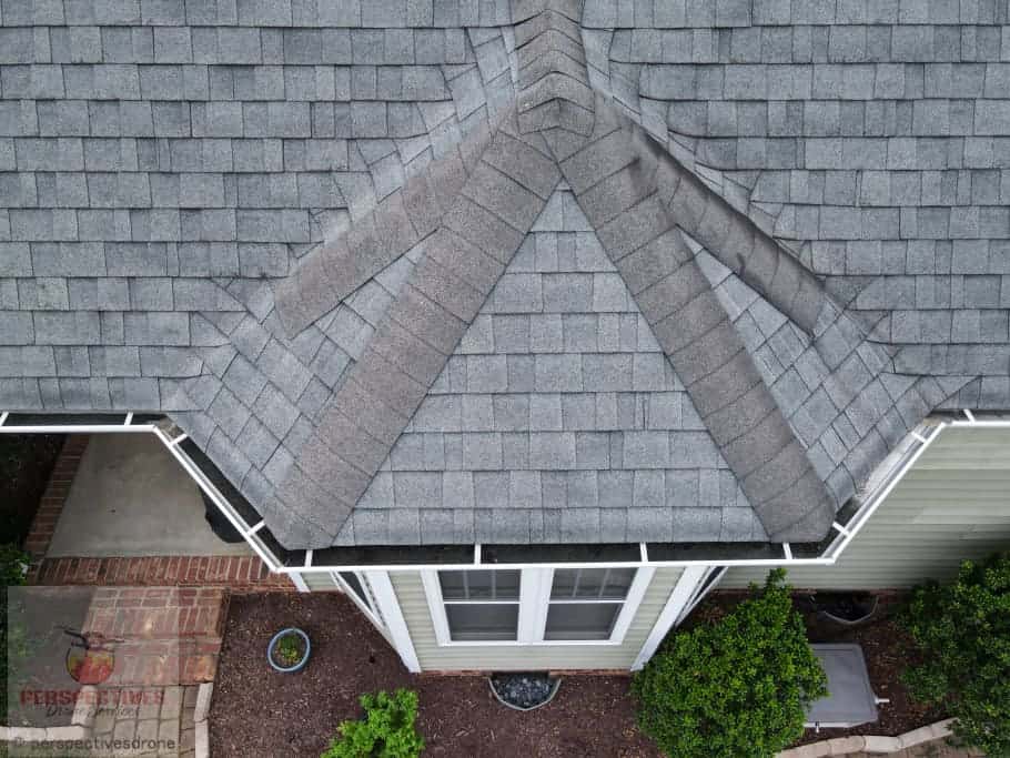 An aerial view of a gray shingled roof.