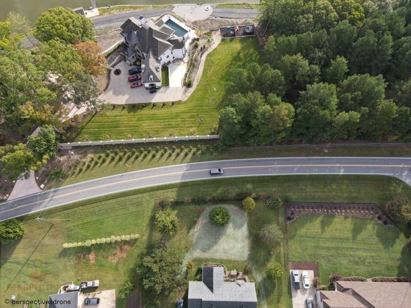 An aerial view of a house and a road.