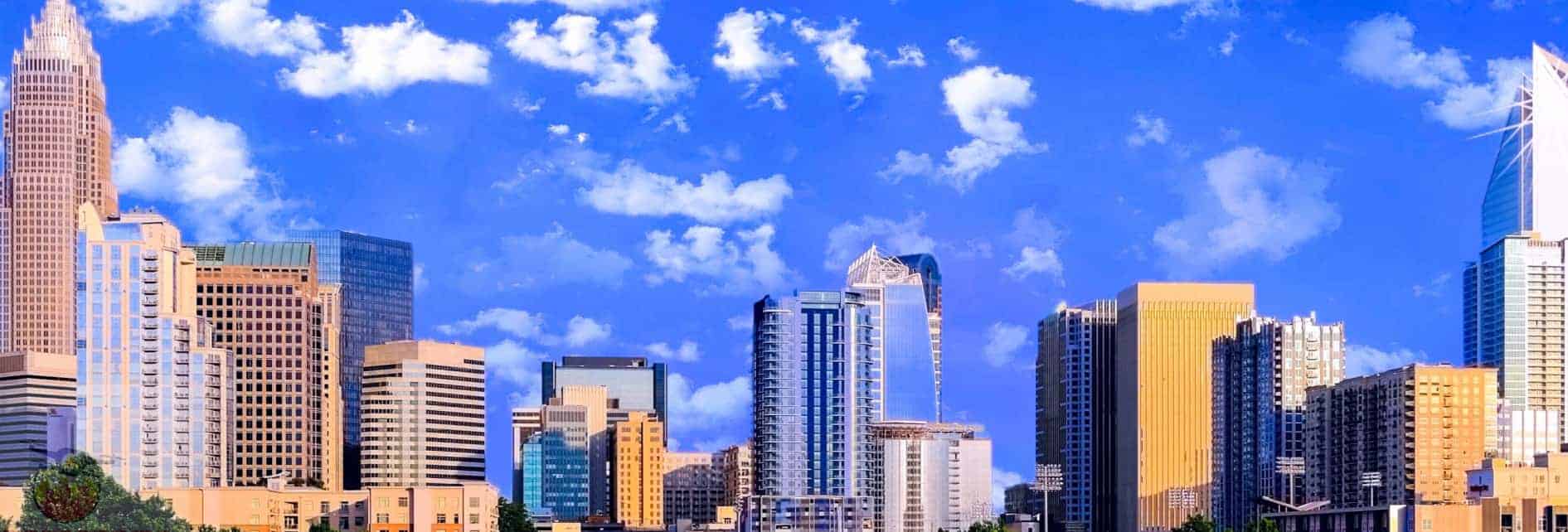 A city with tall buildings and clouds in the sky.