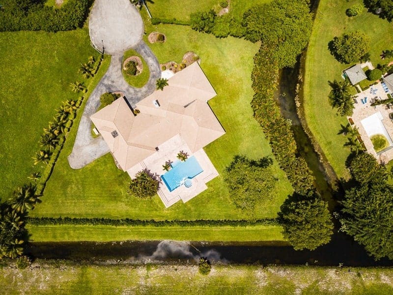 An aerial view of a home with a pool.