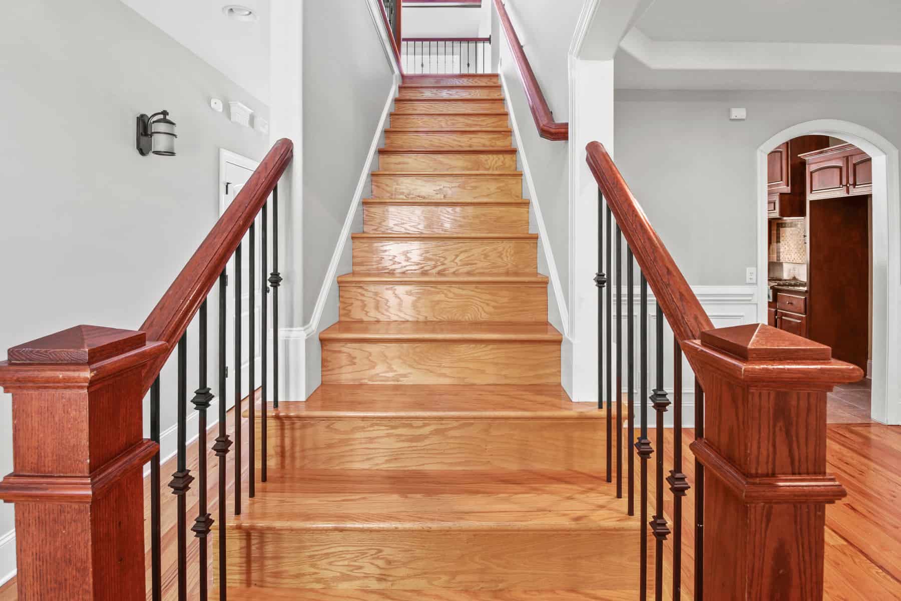 A staircase in a home with wood railings.