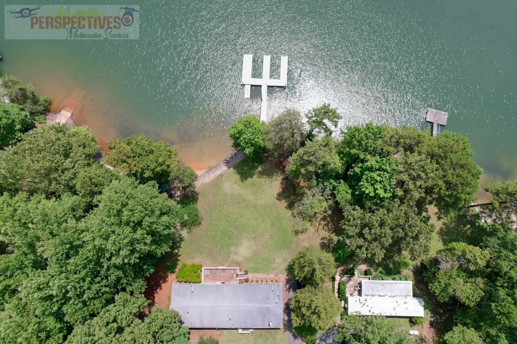 A house with a dock in the water.