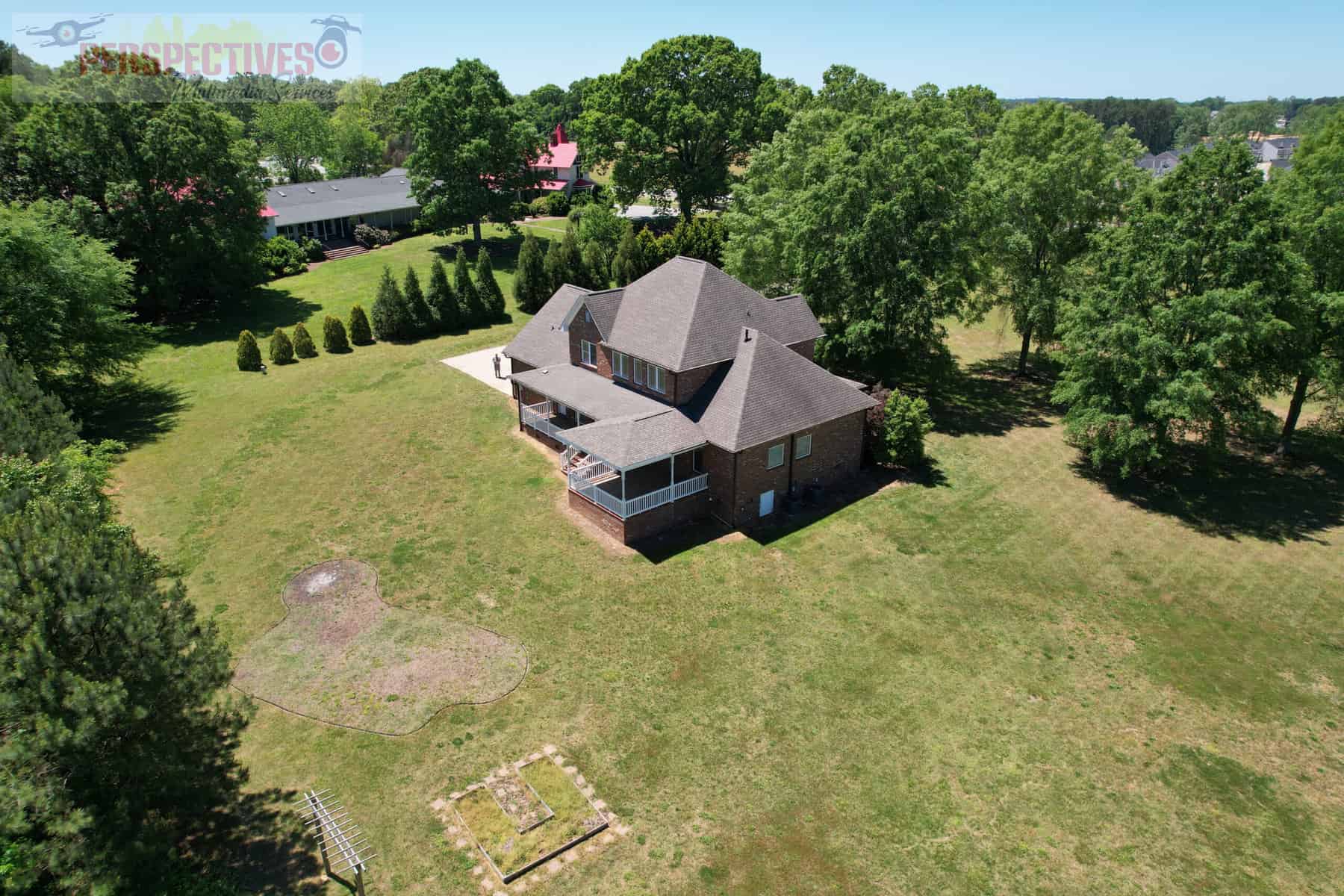 A house with a lawn and trees.