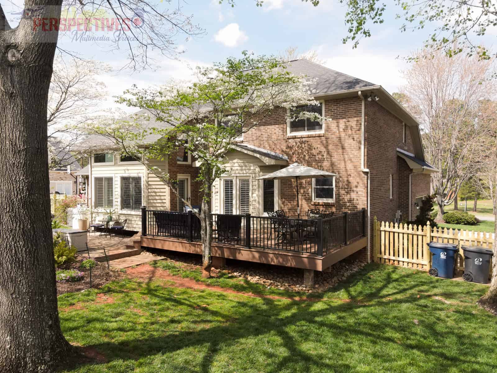 A house with a fence and a yard.