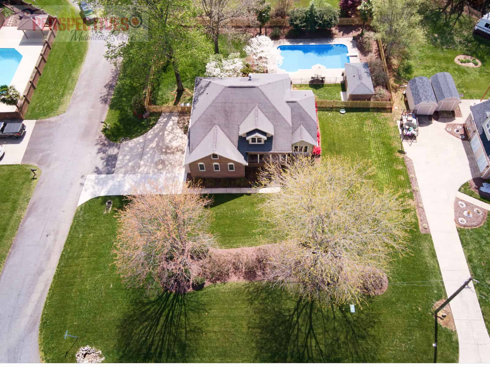 A house with a pool in the back.