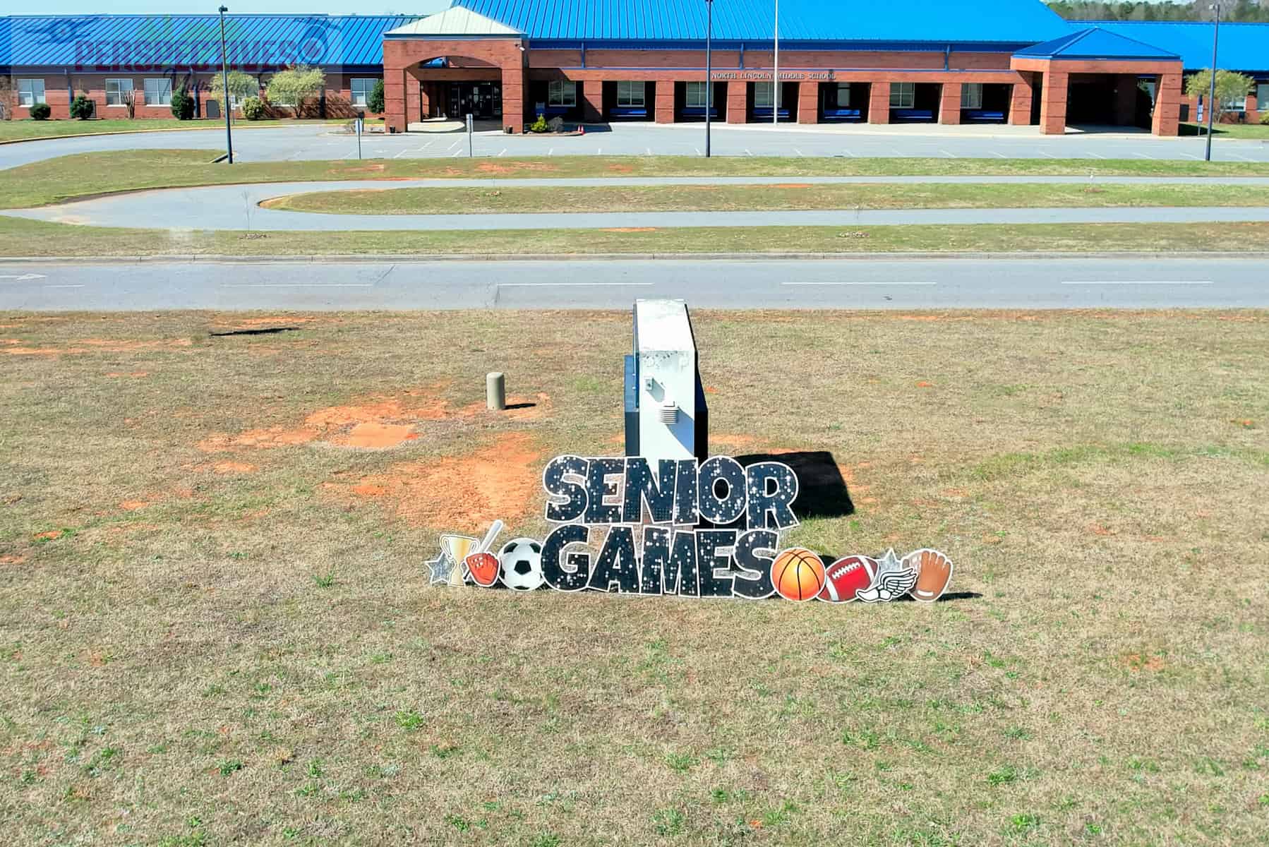 A sign on the grass.