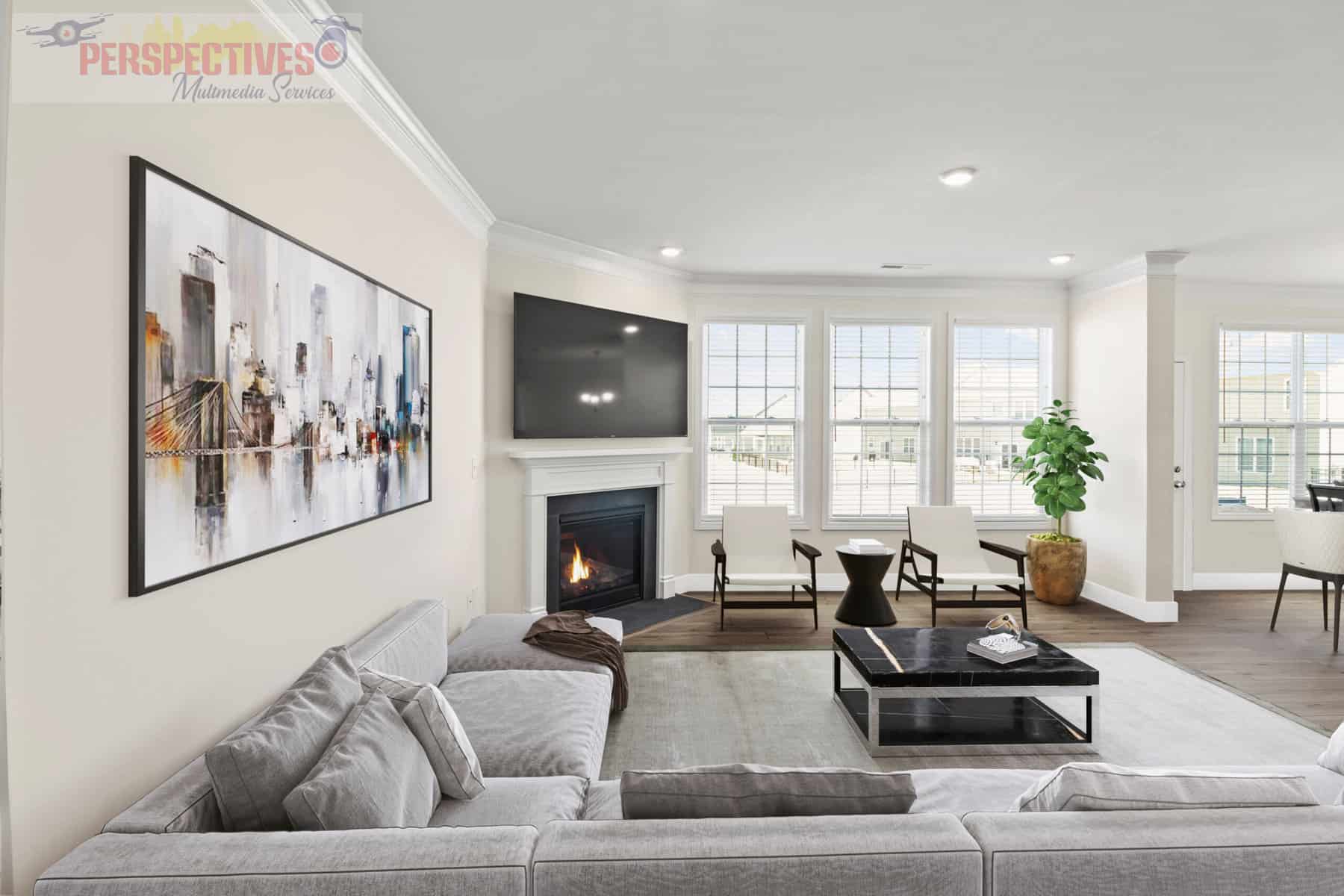 A living room with hardwood floors and a fireplace.