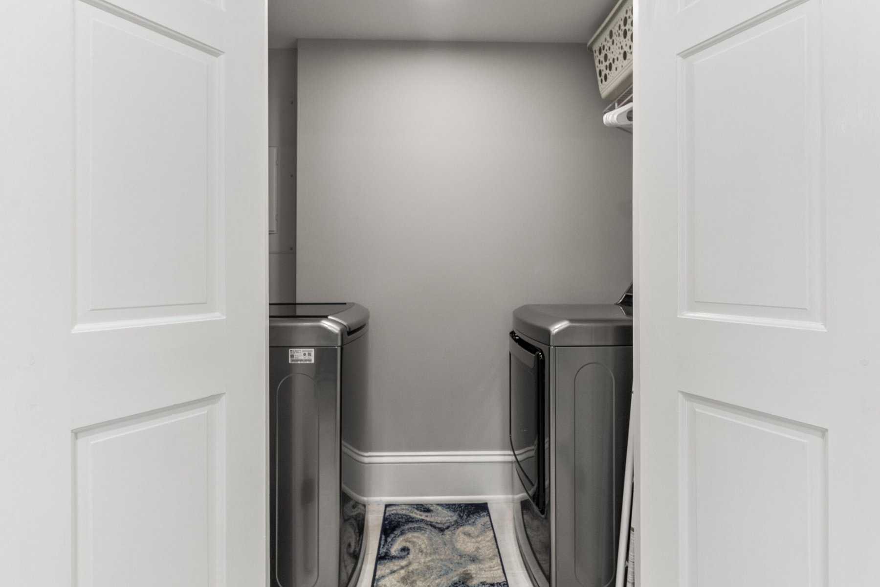 A laundry room with a washer and dryer.