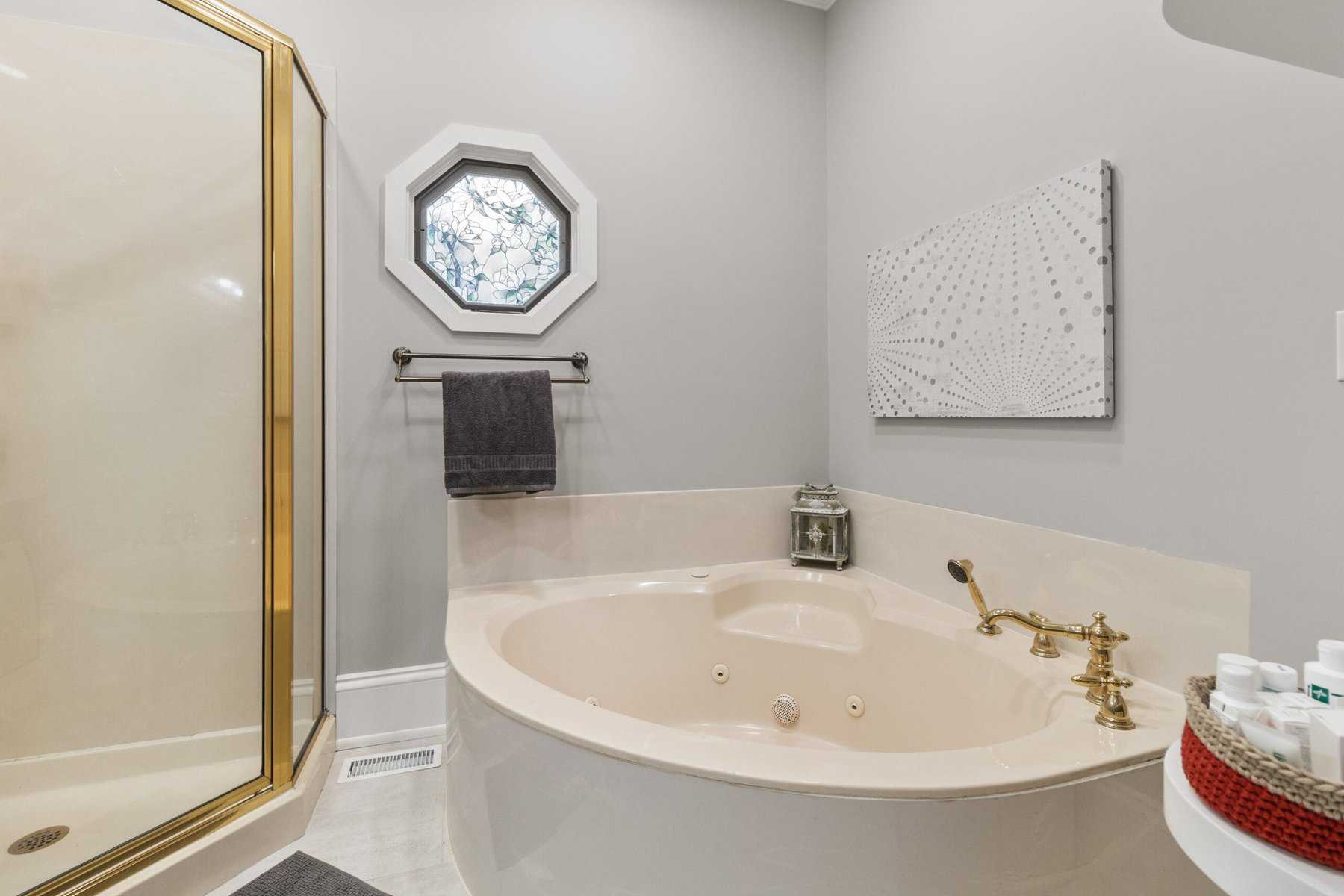 A bathroom with a jacuzzi tub and shower.