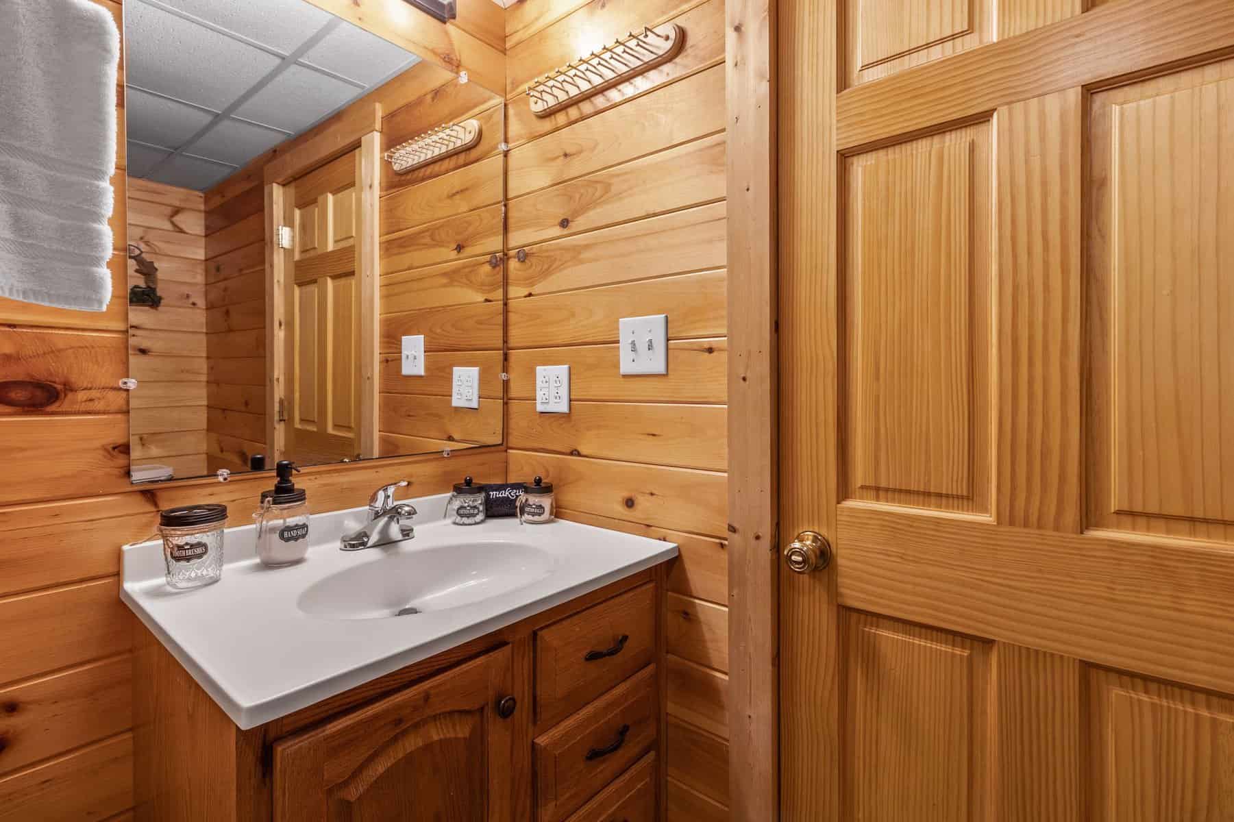 A bathroom in a log cabin.