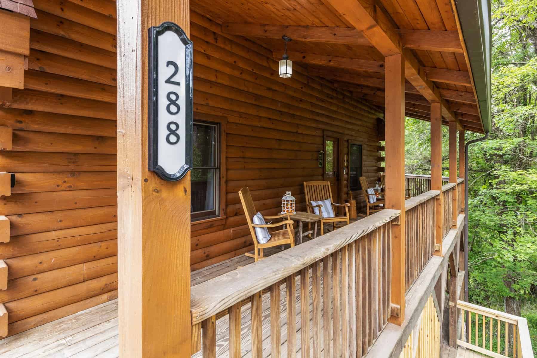 The porch of a log cabin in pigeon forge, tennessee.