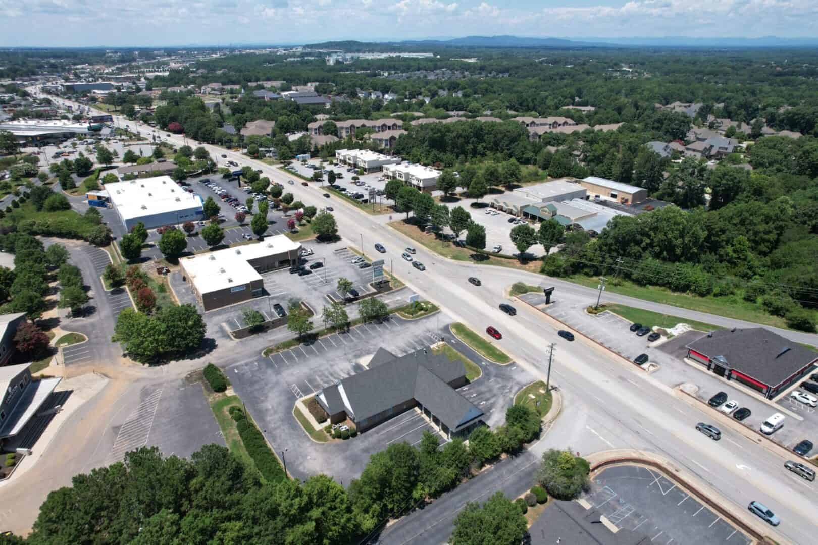 An aerial view of a parking lot in a city.