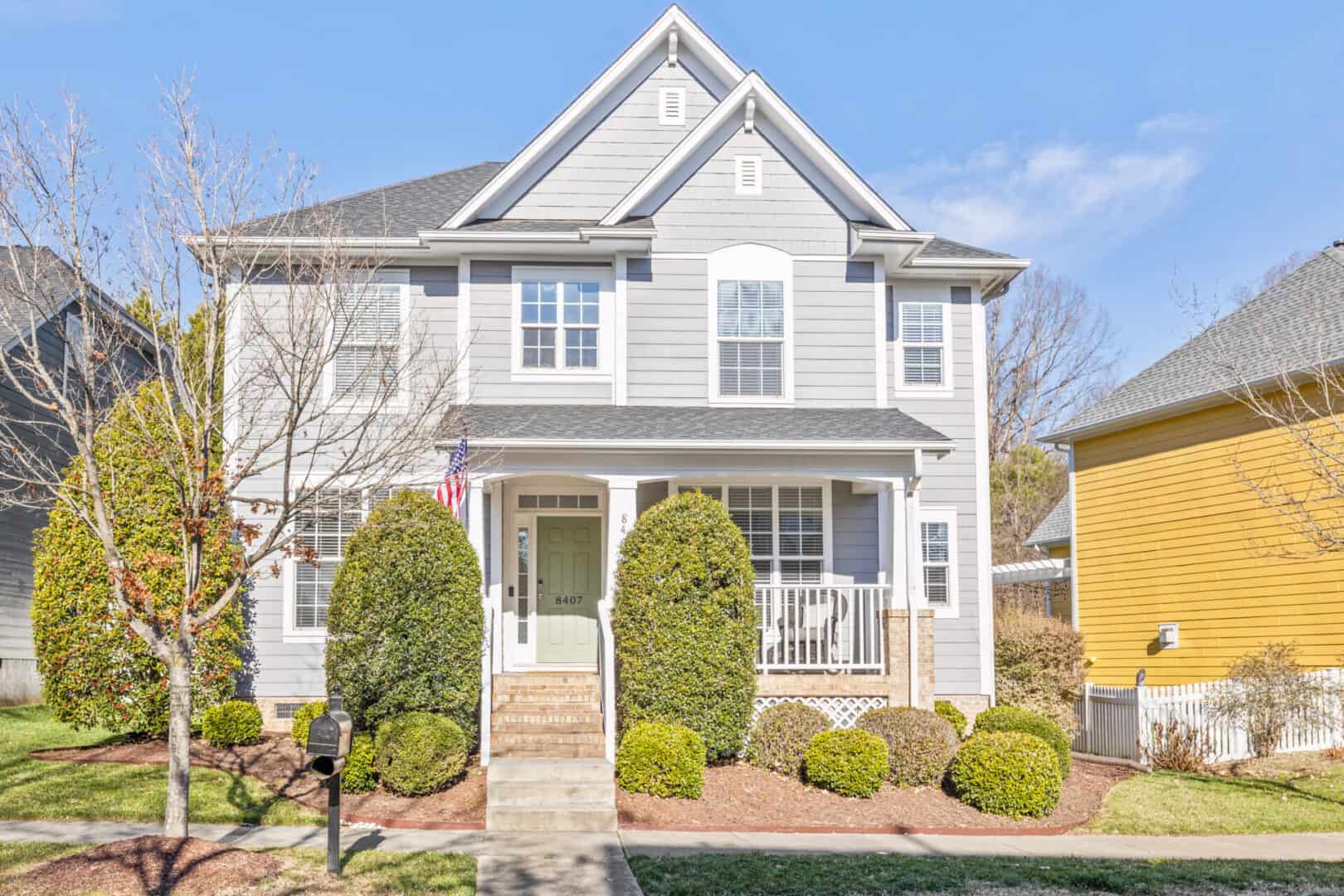 A two story home in a neighborhood.